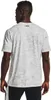 A man wearing a white t-shirt with a camouflage pattern. Produktbild-Vorschau