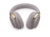 A pair of Bose QC Ultra headphones in Sandstone color, shown from a top-down diagonal angle against a white background. Produktbild-Vorschau