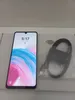 A smartphone and its accessories are laid out on a surface. Produktbild-Vorschau