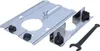A close-up, angled view of a router base plate and an auxiliary base with clamps, along with a wrench, on a white background. Anteprima dell’immagine prodotto