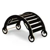 A black wooden climbing arch for children, shown in a studio setting against a white background. Produktbild-Vorschau