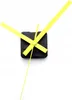 A close-up shot of a clock mechanism with yellow hands against a white background. Produktbild-Vorschau