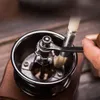 Close-up of a hand using a brush to clean a coffee grinder. Produktbild-Vorschau