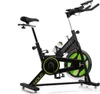 A black and green indoor cycling bike against a white background. Podgląd zdjęcia produktu