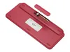 The underside of a red wireless keyboard is shown, with the USB receiver stored in a compartment. Podgląd zdjęcia produktu