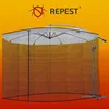 A mosquito net covering a large outdoor umbrella. Anteprima dell’immagine prodotto