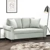 A light gray sofa with decorative pillows in a room setting. Produktbild-Vorschau