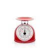 A red kitchen scale with a silver weighing plate and a white dial face is shown against a white background. Náhľad obrázku produktu