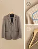 A collage of images showcasing wooden hangers and a suit jacket. Náhled obrázku produktu