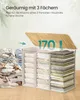 A laundry basket with three compartments filled with folded laundry, next to a pile of unfolded laundry. The lid is open, revealing the interior. Produktbild-Vorschau
