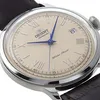 Close-up of an Orient Bambino watch face with a brown leather strap. Produktbild-Vorschau