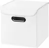 A white fabric storage cube with a lid and a silver handle on the front. Produktbild-Vorschau