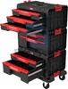 A black and red modular tool chest with multiple drawers, some of which are open, displayed on a light gray background. Anteprima dell’immagine prodotto