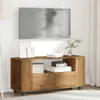 A TV stand with a TV mounted above it in a room. Produktbild-Vorschau