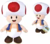 Two plush toys of the character Toad from Super Mario Bros. are shown against a white background. The larger toy is in the foreground, and a smaller one is in the background to the right, holding a Super Mario Bros. tag. Produktbild-Vorschau