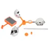 A solar-powered bird repeller with rotating arms and reflective surfaces, along with some small accessory parts, is displayed against a white background. Podgląd zdjęcia produktu