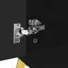 A close-up view of a cabinet hinge attached to a black surface. Anteprima dell’immagine prodotto