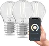A hand holding a smartphone displaying a smart lighting app, with three smart LED bulbs in the background. Produktbild-Vorschau