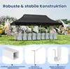 A black pop-up canopy tent set up outdoors for an event, with tables and chairs covered in white fabric. Náhled obrázku produktu