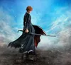 A figure of Ichigo Kurosaki from Bleach, holding a sword, standing on a rocky terrain with a cloudy, starry sky in the background. Anteprima dell’immagine prodotto