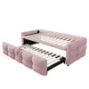 A pink upholstered daybed with a trundle bed pulled out. Podgląd zdjęcia produktu