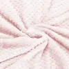 A close-up, swirled view of a soft, textured pink blanket. Náhled obrázku produktu