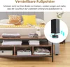 A close-up of a couch table with storage, featuring adjustable feet and decorative pillows on a bed in the background. Voir les images du produit