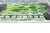 A close-up, low-angle view of a rug with a street and park design. Produktbild-Vorschau