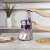 A person is using a food processor in a kitchen setting. Produktbild-Vorschau