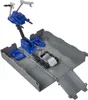 A toy playset with a blue crane and a silver vehicle inside a gray container. Produktbild-Vorschau