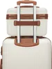A close-up view of the top of a white and brown luggage set, showing the handle and the attachment of a smaller beauty case on top of a larger suitcase. Anteprima dell’immagine prodotto