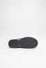 The sole of a shoe is shown against a white background. Voir les images du produit