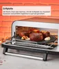 Close-up of steaks cooking on a grill plate inside an oven. Anteprima dell’immagine prodotto