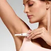 A woman is using a Philips personal trimmer on her underarm. Náhled obrázku produktu