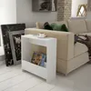 A modern white side table with magazines and a cup of coffee next to a sofa in a living room. Anteprima dell’immagine prodotto