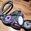 A close-up view of a vacuum cleaner filter set on a wooden floor. Produktbild-Vorschau