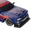 Close-up of the front of a blue remote-controlled drift car with red flame graphics. Produktbild-Vorschau
