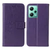 A purple flip phone case with a floral and butterfly embossed design is shown open and closed. Produktbild-Vorschau