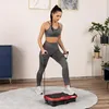A woman is exercising on a vibration plate with resistance bands in a room. Náhled obrázku produktu