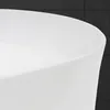 A close-up view of the edge of a white ceramic sink against a dark textured background. Náhled obrázku produktu