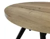 A close-up view of a round wooden table with black legs. Náhled obrázku produktu