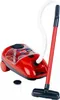 A red toy Vileda vacuum cleaner with a white hose and a black and red handle and floor attachment, shown on a white background. A small clear container with a black lid is also present. Produktbild-Vorschau