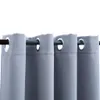 A close-up view of gray curtains with metal grommets hanging from a curtain rod. Náhled obrázku produktu