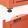 Close-up views of an orange metal cabinet's adjustable foot and a USB port. Voir les images du produit