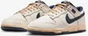 A pair of Nike Dunk Low SP "Phantom" sneakers are shown from a diagonal angle against a white background. Produktbild-Vorschau