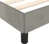 Close-up of the corner of a bed frame with wooden slats and a black leg. Náhľad obrázku produktu