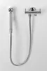 A chrome WC hand shower with a double valve and cistern water connection mounted on a white wall. Anteprima dell’immagine prodotto
