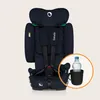 A navy blue car seat with green accents, shown against a light beige background. A circular inset highlights a black cup holder with a water bottle inside. Produktbild-Vorschau