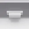 A close-up, straight-on view of a white ceramic washbasin with a gray cabinet underneath, mounted on a light gray wall. Náhled obrázku produktu