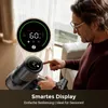 A man is using a cordless vacuum cleaner with a digital display. Produktbild-Vorschau